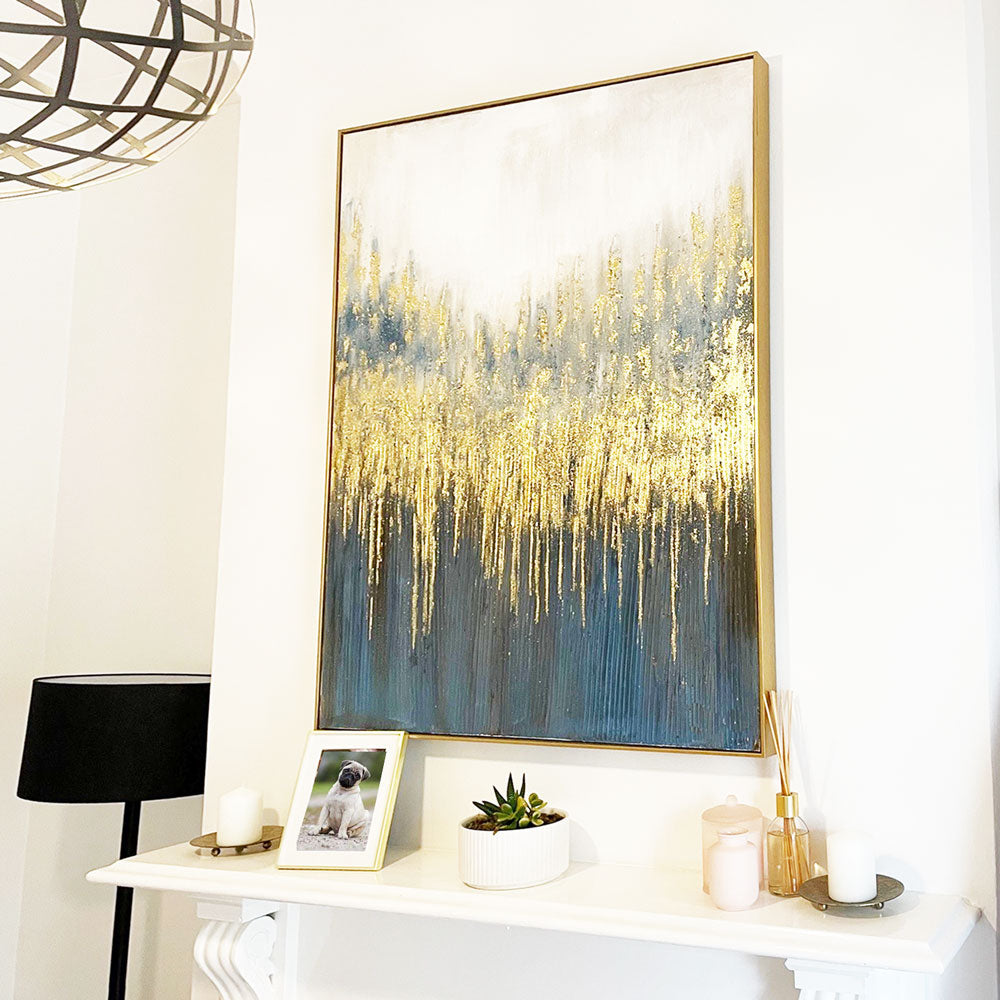 gold wall art with blue accents