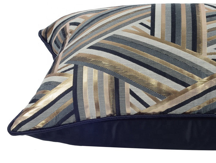 luxe cushion with golden and grey stripes