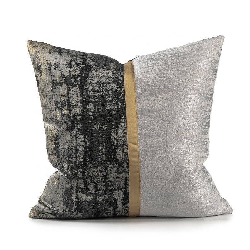 Gold and black cushion with silver panelling
