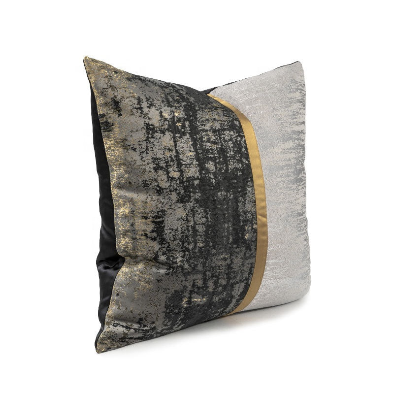 Silver and black cushion with gold highlights