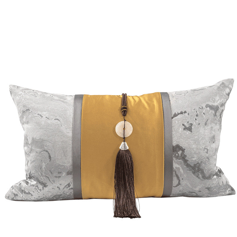 Gold bolster cushion with silver panelling