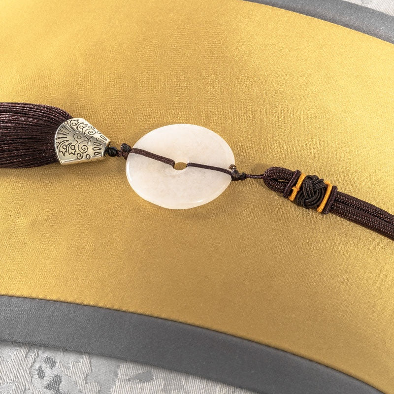 Gold luxe cushion with centre bead