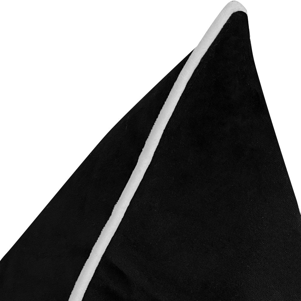 white piping on black velvet cushion